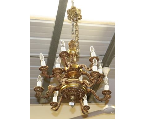 A brass twelve light chandelier (a.f.)