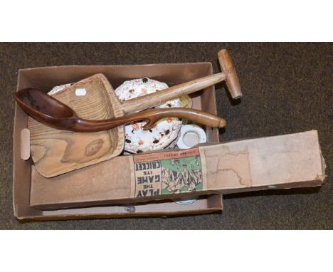 A treen dairy ladle, an elm toffee spade, a boxed disc bat cricket game, three wood curtain poles, a reproduction brass box s