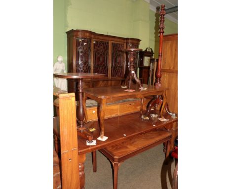 A group of mahogany furniture comprising two coffee tables, a pedestal table, a wine table, and a standard lamp