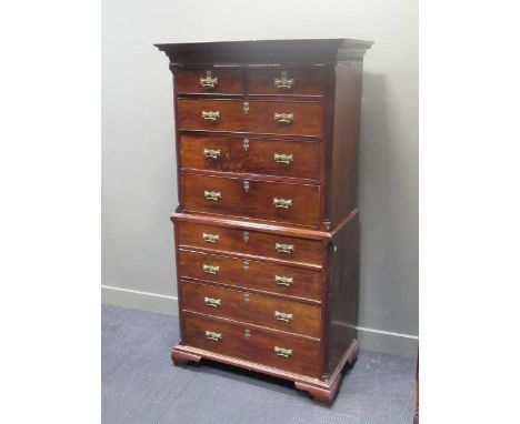 A George III mahogany chest on chest raised on ogee bracket feet, 196 x 107 x 61cm