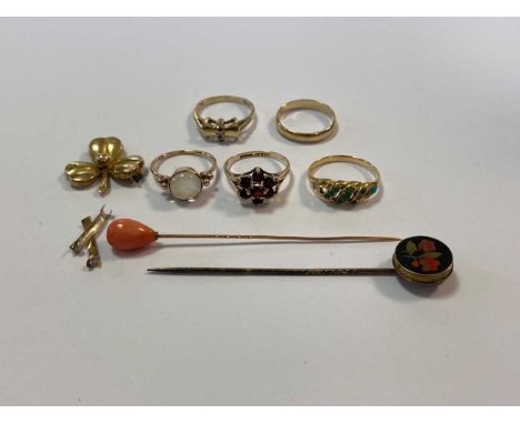 two stick pins tested as 9ct gold, three hallmarked 9ct gold gemset rings, one hallmarked 9ct gold wedding ring, a hallmarked