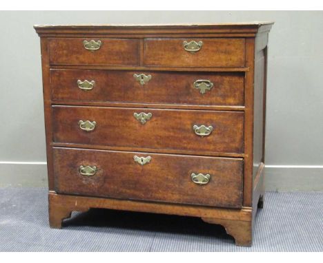 A George III countrymade oak chest of drawers with panelled sides, fitted with two short and three long drawers, on bracket f
