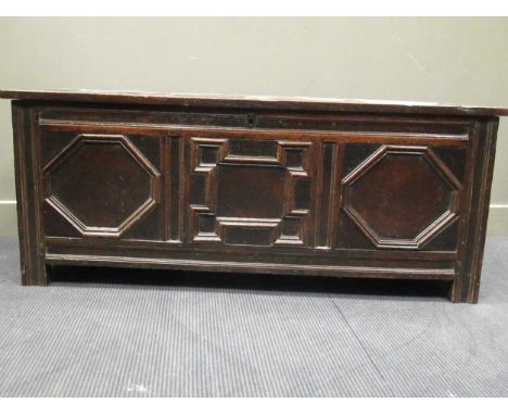 An 18th century oak three panel coffer with geometric mitre moulded decoration on stile feet, 60.5 x 148 x 57cm