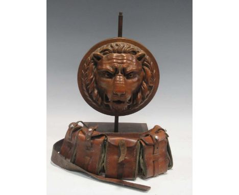 A carved oak lions mask plaque mounted as a lamp base, A wall piece 19th century percussion muzzle loading gun with carved st