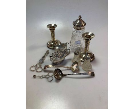 Two silver mustards, two silver topped cut glass pepperettes, a silver topped cut glass sugar caster, a silver sugar sifter, 