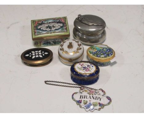An 18th century enamel blue ground patch box, with panel of flowers to the lid (damaged); together with three other later box