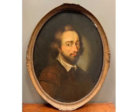 English School 17th century style Portrait of a gentleman, half-length, oil on panel, oval, 62.5 x 47.5cm, framed 69 x 54cmCo