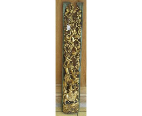 A Chinese painted and gilt carved vertical panel with a sage on horseback below flowering branches and birds, 103cmCondition 