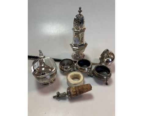 A pair of silver cauldron salts, a silver mustard, a silver napkin ring, a silver sugar caster, a silver topped bottle stoppe