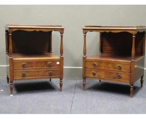 A pair of 20th century mahogany bedside cabinets, the three quarter low gallery top above an open shelf with a two drawer bas