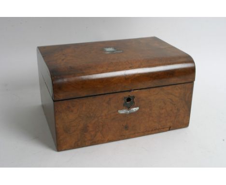 A walnut work box having mother of pearl detail and contents