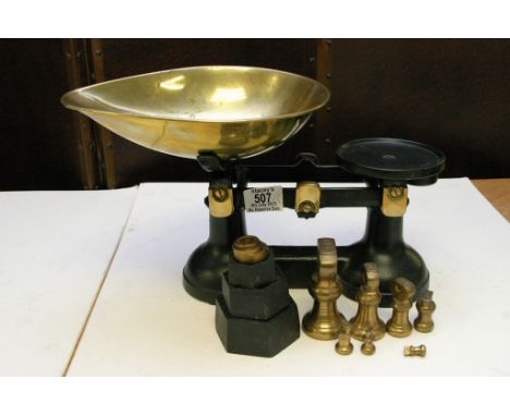 A set of weighing scales with weights