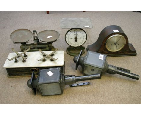 A pair of coaching lamps, a clock playworn double O gauge train set, three set of scales