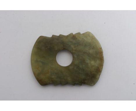 A Chinese green jade design axe head, or Fu, of archaic design in the Shang Dynasty style. Length: 64mm approximately