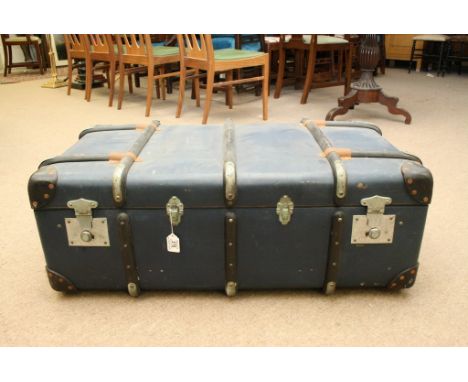 A large blue travelling trunk with removable inner tray