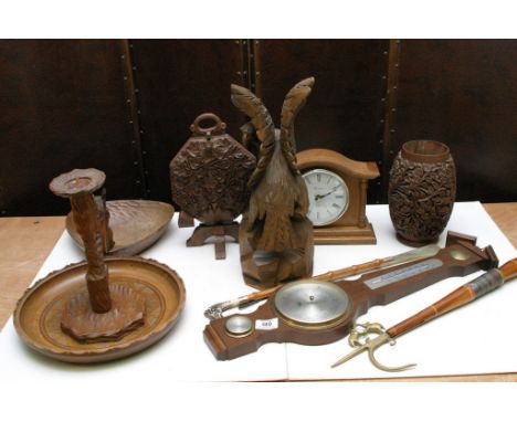 A box of various wooden items including a barometer and clock