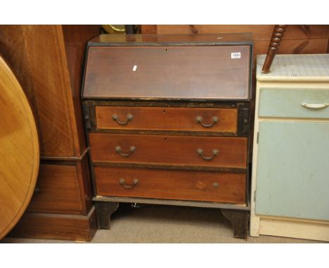 An Edwardian mahogany inlaid bureau, the full front above three long drawers on bracket feet. 