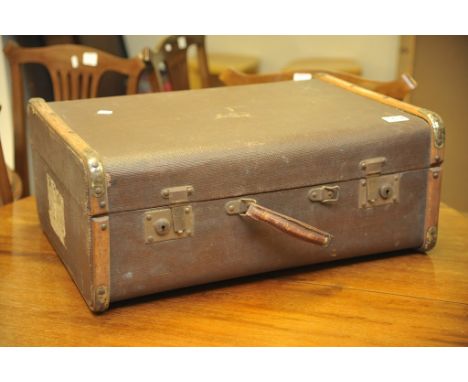 A canvas and wooden bound travelling trunk 