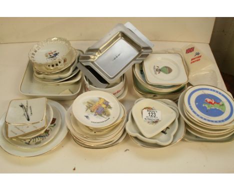 A collection of mixed ceramic and metal ash trays