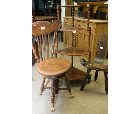 A three tier turned wood 'whatnot', a spinning or music chair and a rustic stool