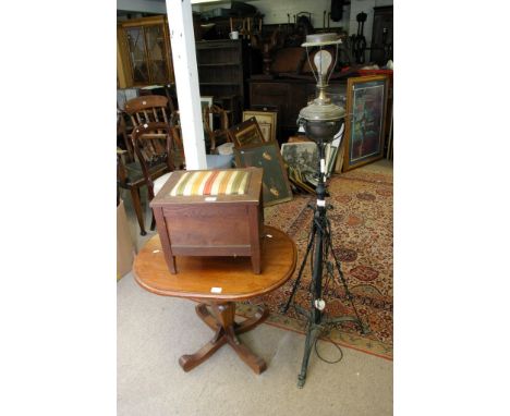 An iron floorstanding lamp, occasional table and sewing box