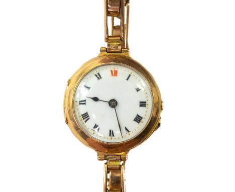 An early 20th century 15ct gold ladies manual wind wristwatch. With 15ct expanding bracelet, gross weight 21.8g.No winding cr