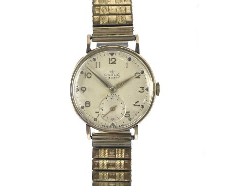 A Smiths Deluxe 9ct gold 1940's gentleman's wristwatch. Manual wind 15 jewel movement, the 27mm silvered dial with gilt Arabi