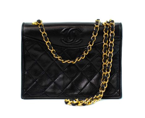 A Chanel Mini Full Flap handbag in black quilted lambskin with gold tone hardware. 1989-91, serial number sticker and authent