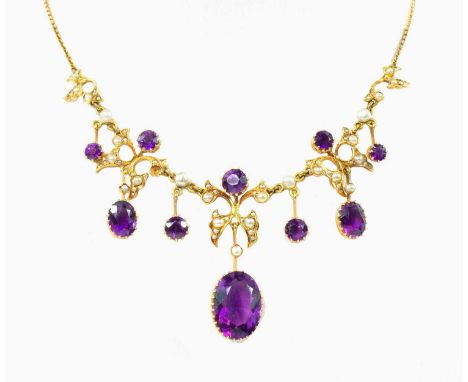 Of openwork design set with pearls and three claw set amethysts and seven amethyst pendent drops, the large central stone mea