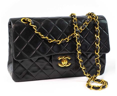 A Chanel Double Flap handbag in black lambskin with gold tone hardware. 1996-97, serial number sticker, width 23cm, height 15