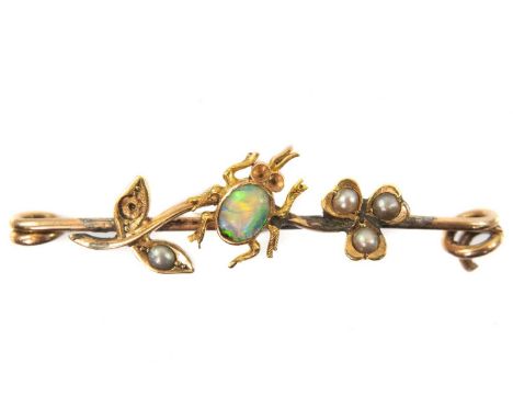 Applied with an insect on a flower set with opal and seed pearls, length 38mm, 2.3g.