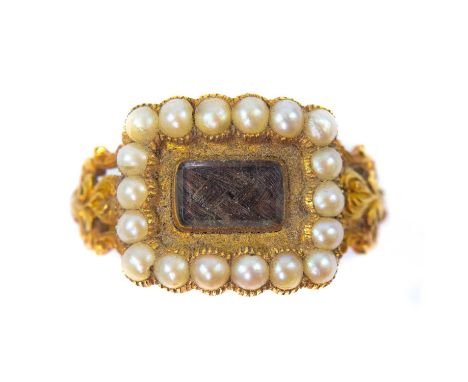 A Georgian high purity gold seed pearl set mourning ring with glazed hair panel. The rectangular head measuring 12 x 14mm, th