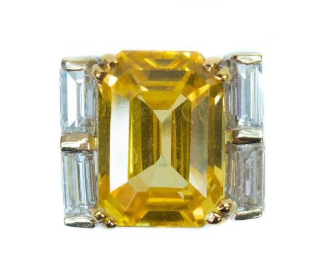 Boucheron - A yellow sapphire and diamond platinum ring. The Sri Lankan rectangular cut cornered sapphire weighing 9.98 carat