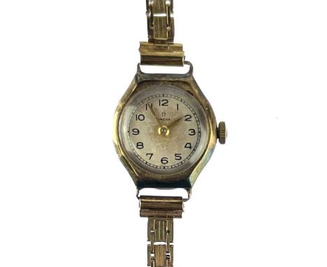 An Omega 9ct gold ladies manual wind bracelet wristwatch, Birmingham 1945, weight excluding movement 14g.