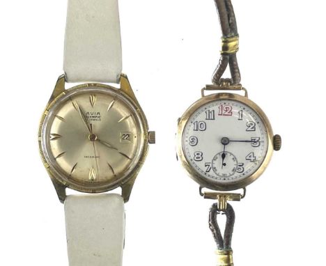 An early 20th century 9ct gold trench manual wind wristwatch. The 25mm white enamel dial with Arabic numberals and seconds di