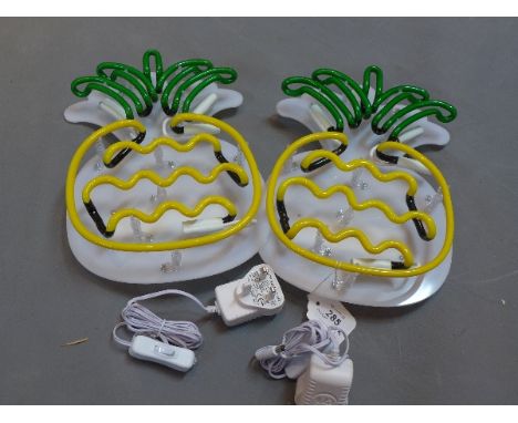 A pair of luminated light if pineapple