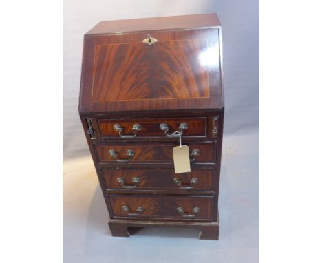 A 20th Century mahogany bureau with drop down flap over four graduating drawers raised on carved bracket feet.