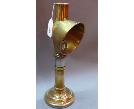 A brass campaign lamp.