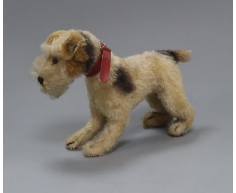 A Steiff dog, original collar, button in ear 1950's height 15cm