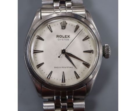 A gentleman's 1950's stainless steel Rolex Oyster manual wind wrist watch, on associated stainless steel bracelet, model no. 