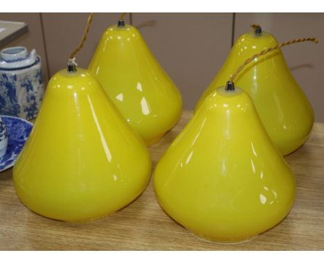 A set of four glass pear shaped light shades height 22cm
