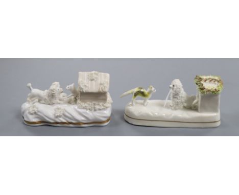 Two rare Staffordshire porcelain kennel groups of a cat confronting a dog, c.1835-50, L. 11.5cm and 12.3cmProvenance - Dennis