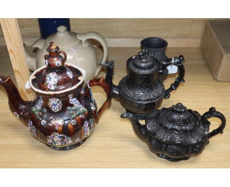 A bargeware treacle-glazed teapot (finial a.f.), a heavy stoneware teapot and three other items, including a Castleford-type 