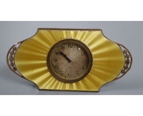 An Art Deco silver and yellow guilloche enamel desk clock with silvered Arabic dial in pierced cartouche mount, Birmingham 19