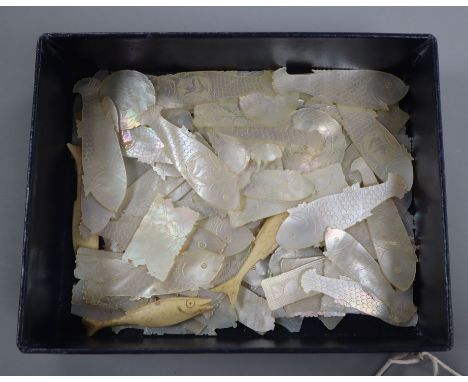 A collection of mother of pearl and bone gaming counters, including fish examples, in embroidered bag