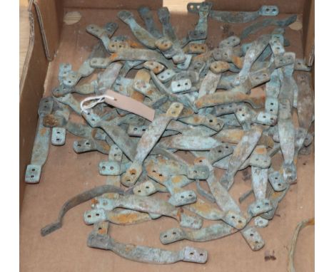 A collection of brass door handles
