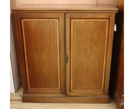 An Edwardian satinwood banded two-door mahogany side cabinet W.108cm