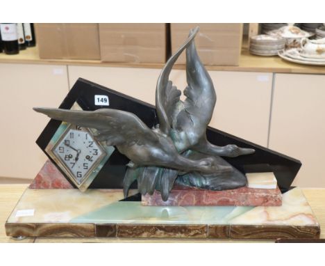 An Art Deco spelter and marble 'ducks' mantel clock