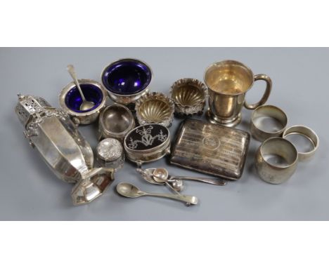 An Edwardian silver sugar caster, silver trinket box, silver salts, napkin rings, cigarette case and a 9ct gold cufflink