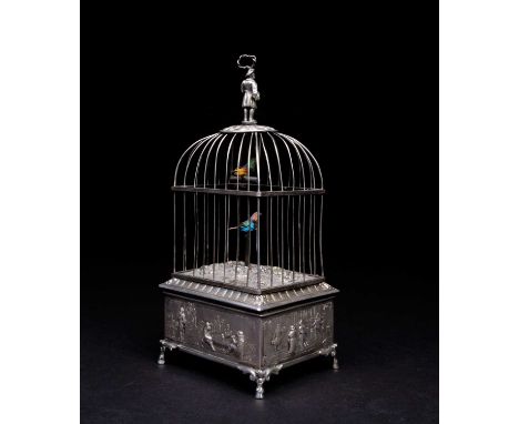 A German silver singing bird automaton, late 19th/early 20th century, of rectangular form with figural knop, the cage housing